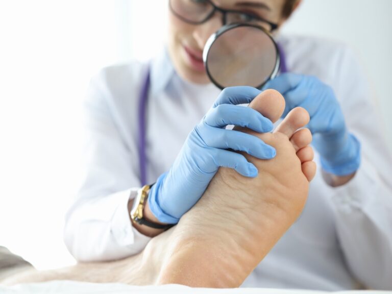 A foot doctor examining a patient’s foot pain.