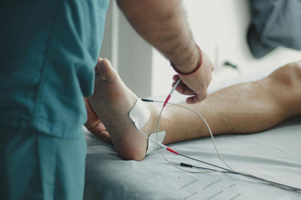 A doctor performs a diagnostic test on a patient's foot, a service available at a podiatry urgent care in Houston