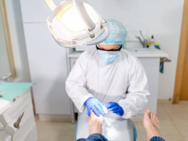 A podiatrist performing surgery for a patient’s bunion.