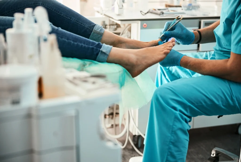 Heel Pain Treatment Cypress includes hygienic nail care. Technician performs pedicure in clean medical treatment room.