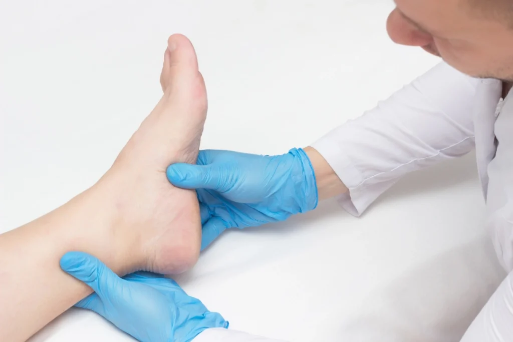 Foot doctor Houston assesses foot condition during medical exam to support mobility, comfort, and preventive care.