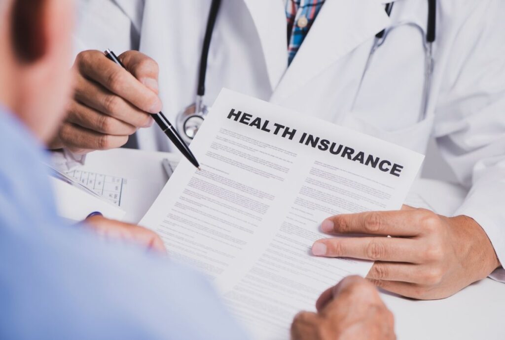 QUTENZA podiatrist Houston explains health insurance coverage options during patient consultation for foot care.