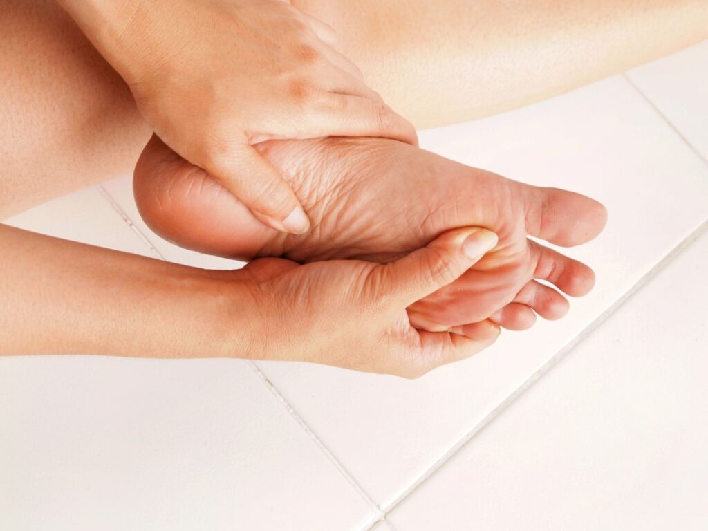 Self-care massage shown as part of Diabetic Wound Care Doctor Cypress recovery plan for foot pain relief