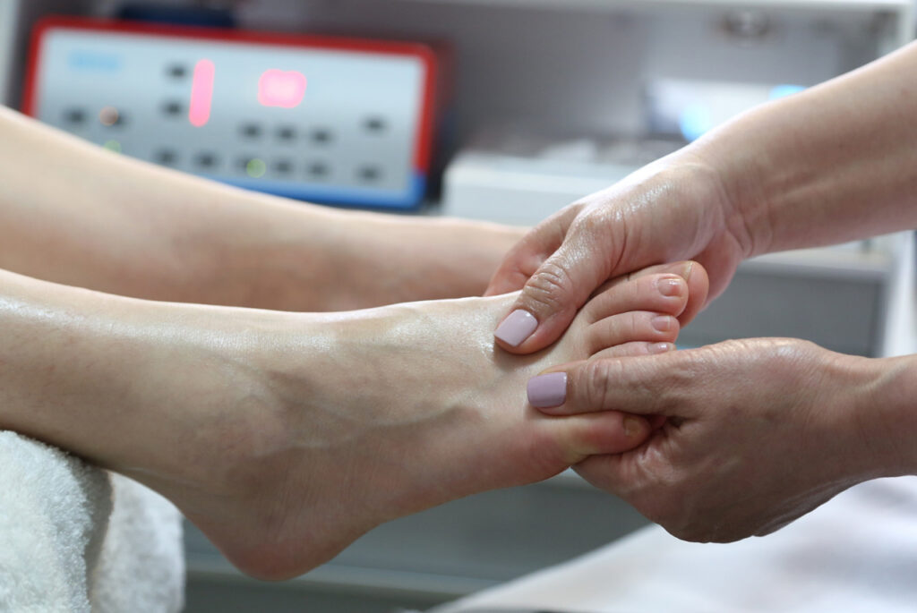 A dpm doctor cypress performs a therapeutic foot massage to improve circulation and relieve chronic podiatry pain.