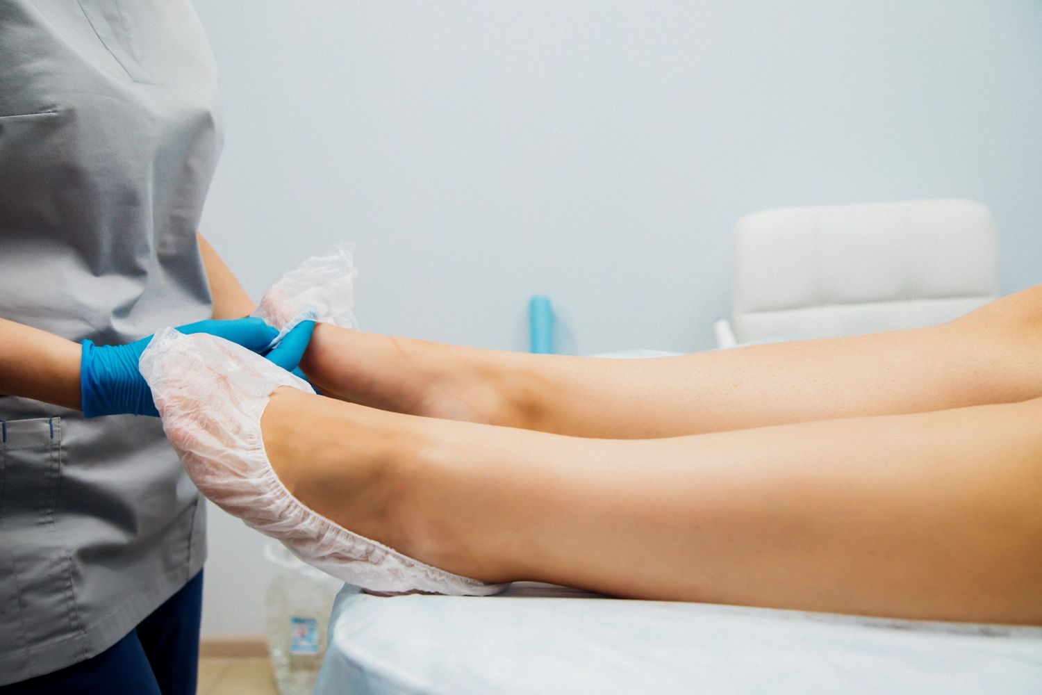Medical staff prepping a patient's foot for the effective QUTENZA treatment Houston clinics use for nerve pain relief.