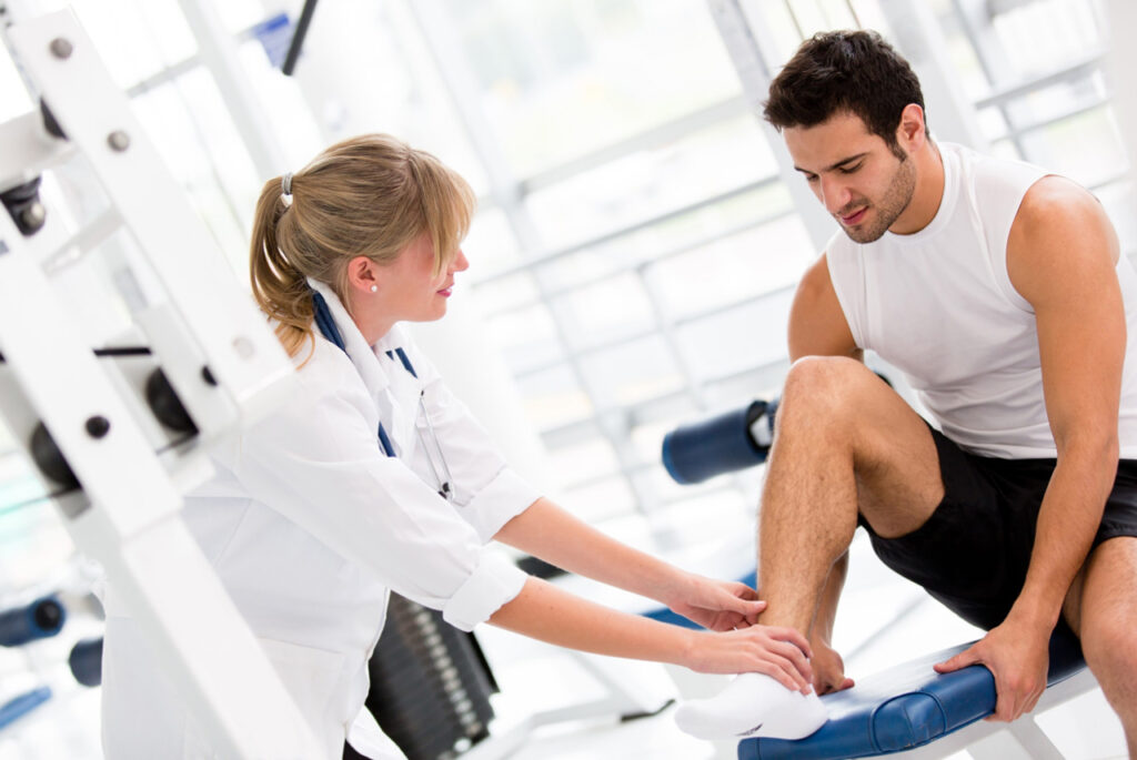 A doctor evaluating the flexibility or range of motion of a patient’s ankle during a follow-up or rehab session.