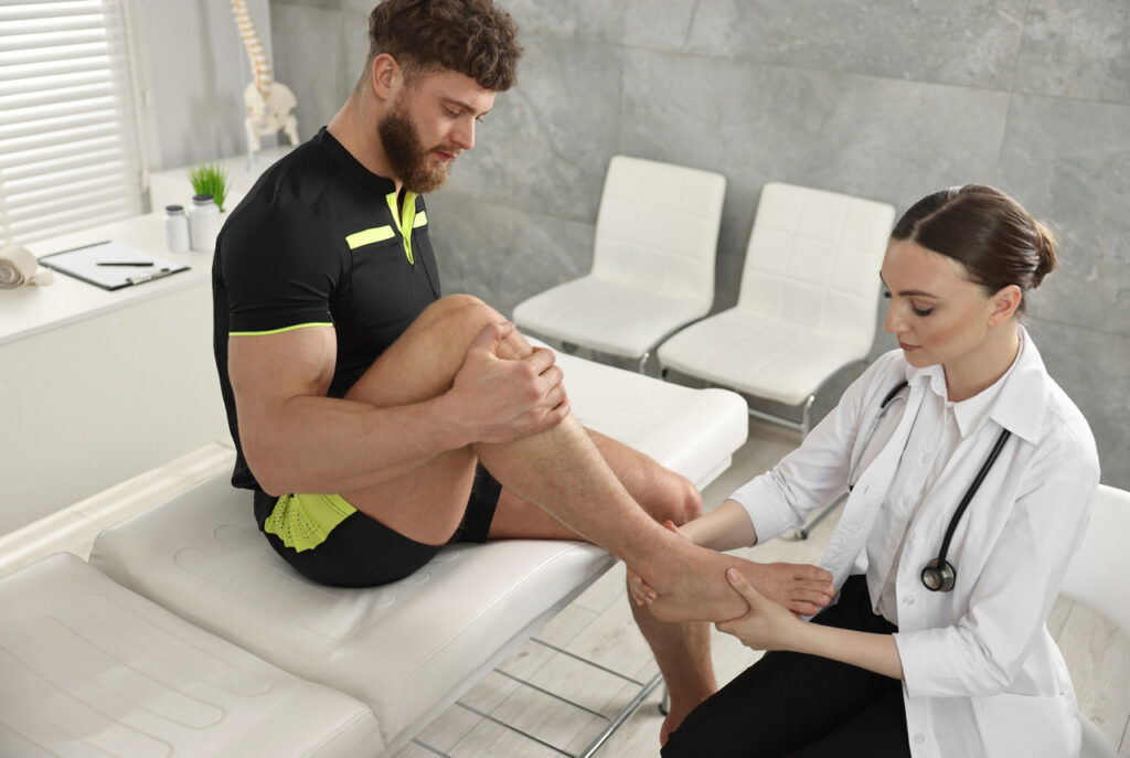 DPM Doctor Cypress providing a sports injury consultation for foot and ankle pain to help an athlete return to play.