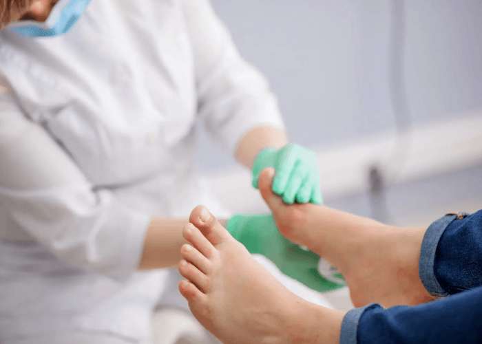 A podiatrist performs a foot exam to provide the plantar fasciitis treatment Cypress residents need for foot relief.