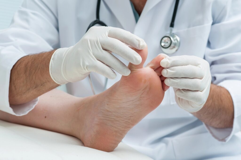 Professional toe doctors Cypress specialists performing a detailed physical foot examination on a patient in-clinic.