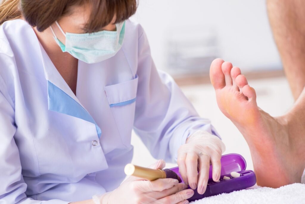 Professional medical pedicure by a Superior HealthPlan podiatrist Cypress specialist using sterile clinical tools.